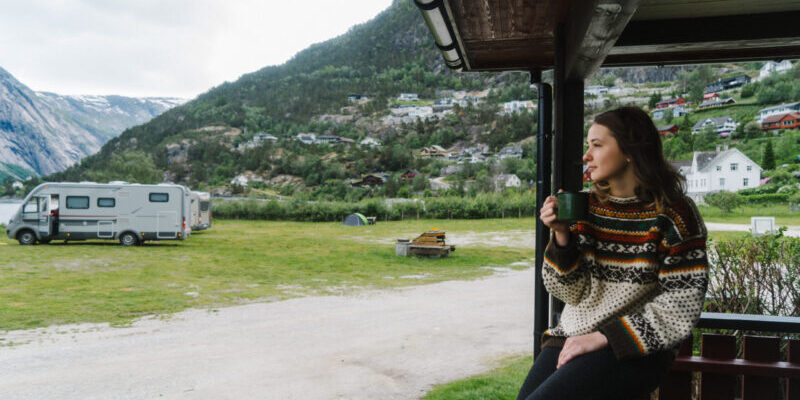 Young Caucasian woman drinking tea in camping in Norway